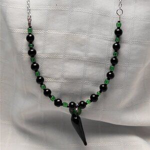 No 1075 Handmade necklace with torch-worked glass pieces shaped like a pepper